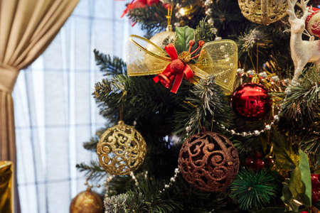 Christmas tree with decorations and Christmas toys, in the form of stars and balls, bows and bells, New Yearの写真素材