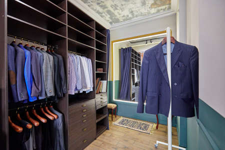 dressing room design, clothes storage room, formal-style clothes hanging on hangersの写真素材