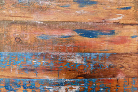 a wall of wooden boards, on which blue strokes of paint, background, wooden wall, building materialsの写真素材