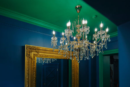 chic huge chandelier hanging on the ceiling in the room in blue tonesの写真素材