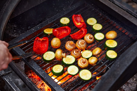 vegetables and mushrooms that are grilled on a charcoal grill, eggplant, mushrooms and pepperの写真素材