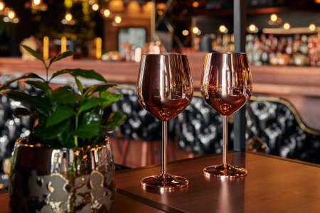 gold metal wine glass, dark backgroundの写真素材
