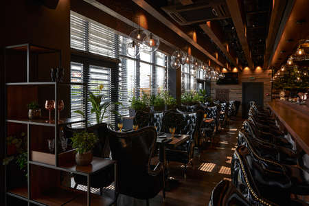 Modern luxury black style interior with black leather chairsの写真素材