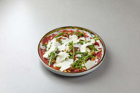 Beef Carpaccio with Rocket and Parmesan Cheeseの写真素材