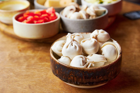 raw dumplings in a wooden bowl close-upの写真素材