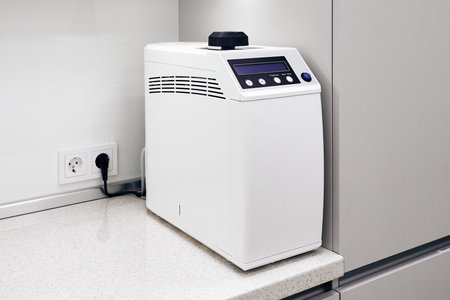 Dental autoclave disinfects tools on desk in medical office
