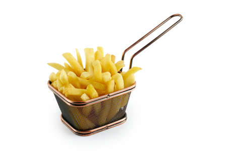 Delicious crusty french fries in mesh metal basket on whiteの写真素材