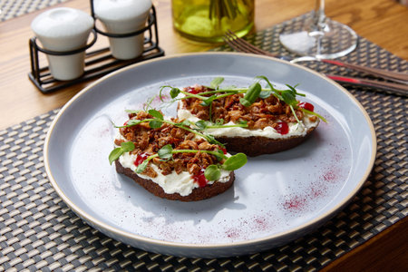Unusual local sandwiches on plate served in luxury restaurant attract tourists attention. Served tasty dish reminds of rich and luxury aestheticの写真素材