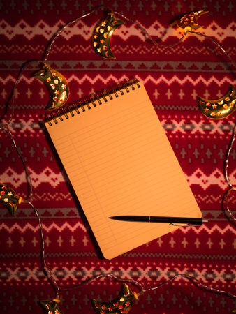 Christmas flat lay. Note and decoration on pattern holiday table. New year's background