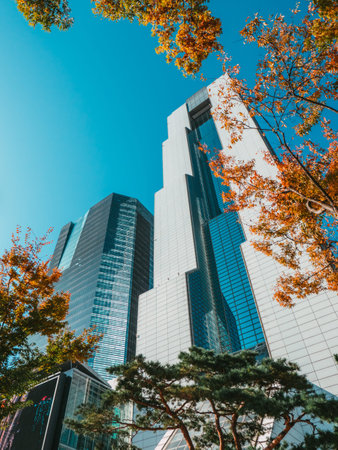 SEOUL / SOUTH KOREA - 10.29.2019: Skyscrapers in Seoul. Low angle view on skyscraper on blue sky. A...