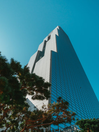 SEOUL / SOUTH KOREA - 10.29.2019: Skyscrapers in Seoul. Low angle view on skyscraper on blue sky. A...
