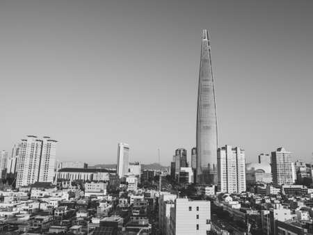 SEOUL / SOUTH KOREA - 04/11/2019: Beautiful view on Lotte Tower. Made by drone. Grayscale photoのeditorial素材