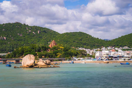 View on the city from ocean. Blue water near beach. Mountain and city backgroundの写真素材