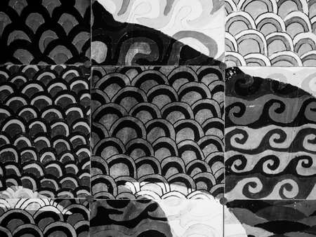 Black and white pattern of tile in Asian temple. Handmade painting on the wall. Asian paintingsの写真素材