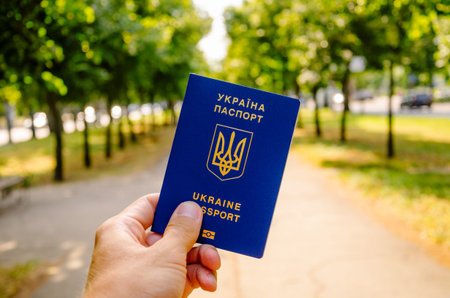 KIEV, UKRAINE - 05/07/2019: Male hand holds Ukrainian passport