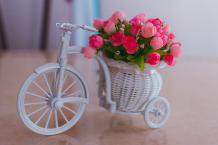 interior decoration of the registry office, small decorative roses in a bicycle basket