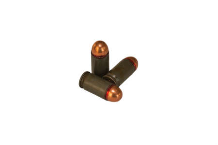 Three 9mm caliber combat pistol cartridges for Makarov pistol on white isolated background side view, weapons and weapons conceptの写真素材