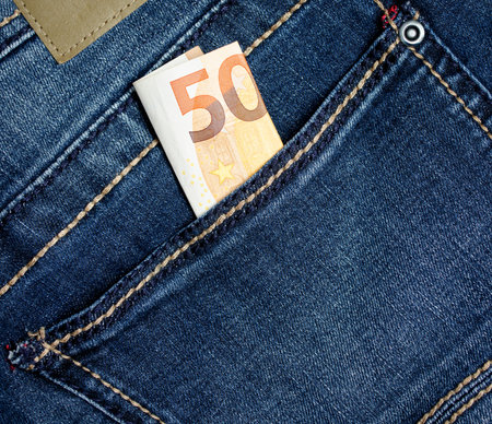50 in the pocket of blue jeans close-upの写真素材