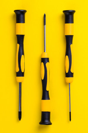 These screwdrivers are arranged in a row, showcasing their design and functionality against a bright backdropの写真素材