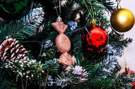 Christmas tree decorated with ornaments and lights for the holiday seasonの写真素材
