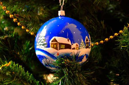 Beautiful, painted, Christmas ball on the Christmas tree. Christmas decoration for christmasの写真素材