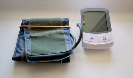 medical electric blood pressure monitor off state on white background