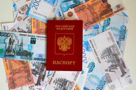 passport of a citizen of Russia against the background of money of various denominationsの写真素材