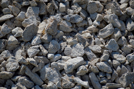 abstract background of broken gravel stones, stones of different sizes and shapes