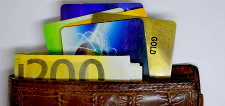 in a leather wallet a two hundred euro note and bank credit cardsの写真素材