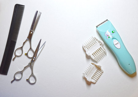 Set of hairdresser on a white background. Clipper, scissors and comb