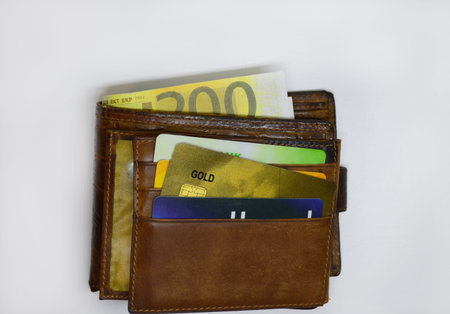 plastic credit cards and euro banknotes in wallet isolated on white background. the concept of...