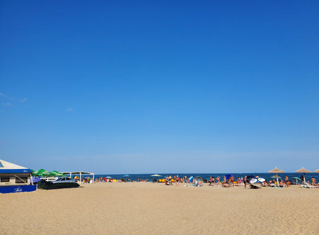 Odessa, Ukraine - August 14, 2021: people relax on the sea beach and bask in the warm rays of the sun. the concept of an active summer holiday at the sea or oceanのeditorial素材