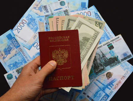 The Russian passport lies on Russian money. dollars insideの写真素材