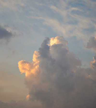 big beautiful clouds in the blue sky during sunset or dawn. beauty in nature. magical sky makes you dream and fall in loveの写真素材