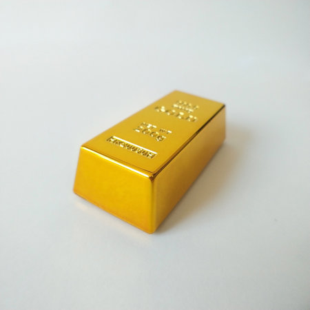ingot of gold of the highest standard on a white background. investment in precious metals. bank reserve during sanctions and financial crisisの写真素材