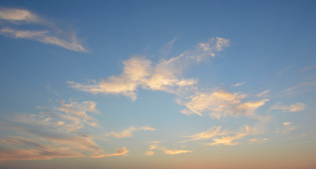 beautiful sky at sunset or sunrise. clouds and the horizon were painted in bright orange, pink and purple colors. beauty in nature. backgrounds and simply beautiful wallpapersの写真素材