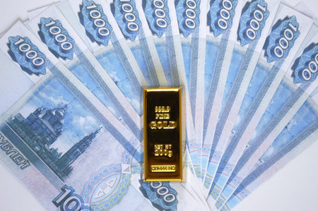Banknotes of Russian rubles with gold ingot. The financial system of Russia, backed by gold. world monetary system. investment in precious metals against the backdrop of sanctions and crisisの写真素材