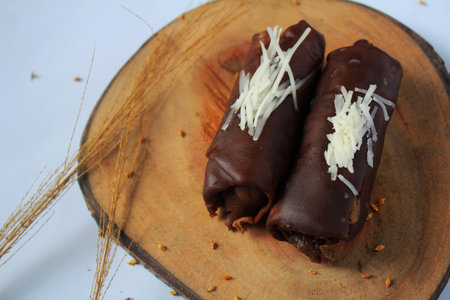 Dadar Gulung Pisang Coklat or Dadar Roll filled with brown banana with a little grated cheese on top...