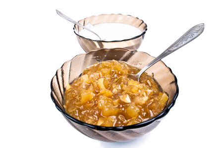 jam and cream in a glass on a white background