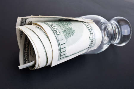 dolar in a class on a black backgroundの写真素材