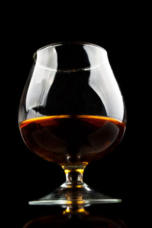 whiskey in a classic glass isolated on a black background
