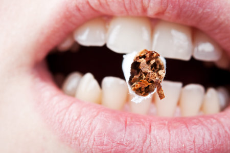 woman holds in the mouth a lot of cigarette