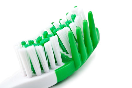 new green toothbrush isolated on a white background