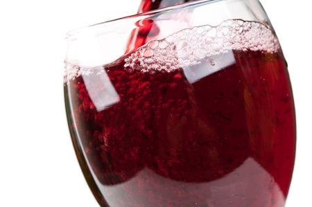 a glass of wine isolated on a white background