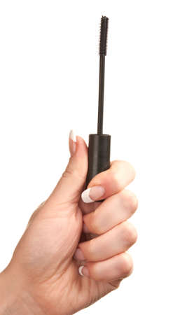 woman holds eyeliner isolated on a white backgroundの写真素材