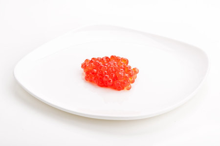 red caviar on white dish backgroundの写真素材
