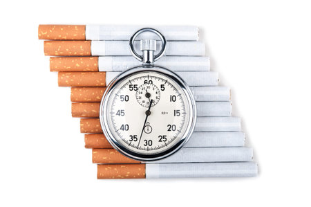cigarettes and stopwatch isolated on a white background