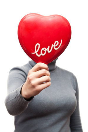 funny woman showing the heart isolated on a white backgroundの写真素材