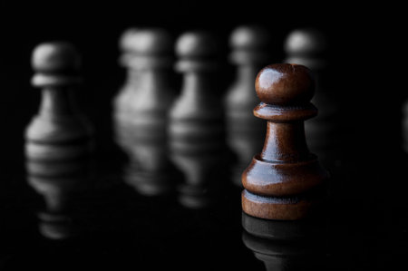 chess pawns isolated on black background