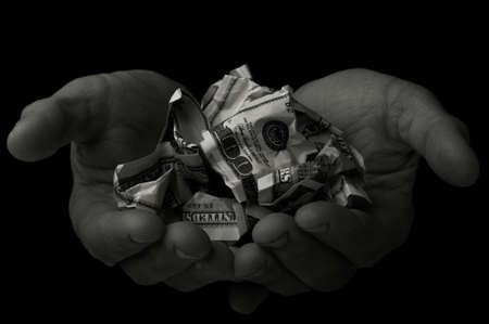 beggar holds his last hundred dollarsの写真素材